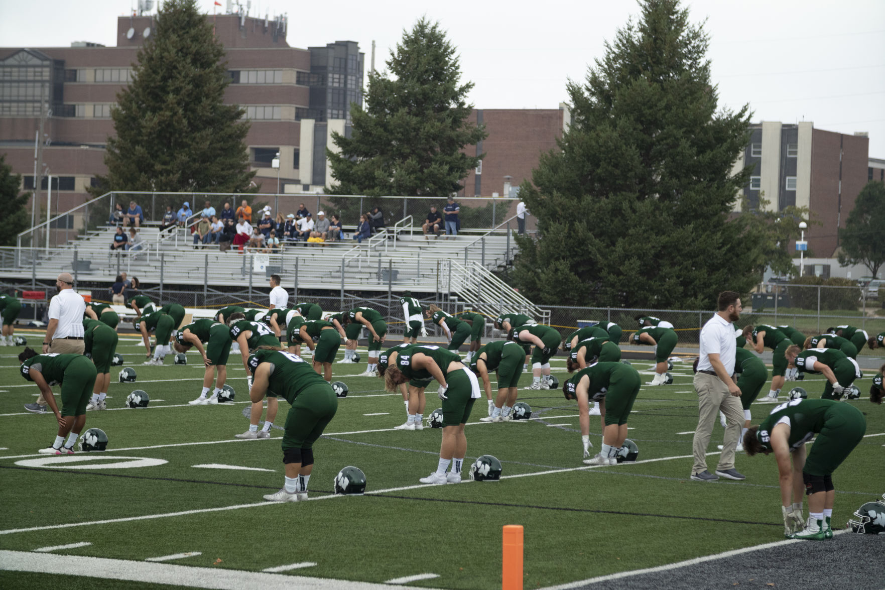 IWU football team warming up